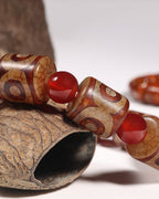 Multi Three Eye Dzi Bead Bracelet In Cylinder-Cut Tibetan Agate